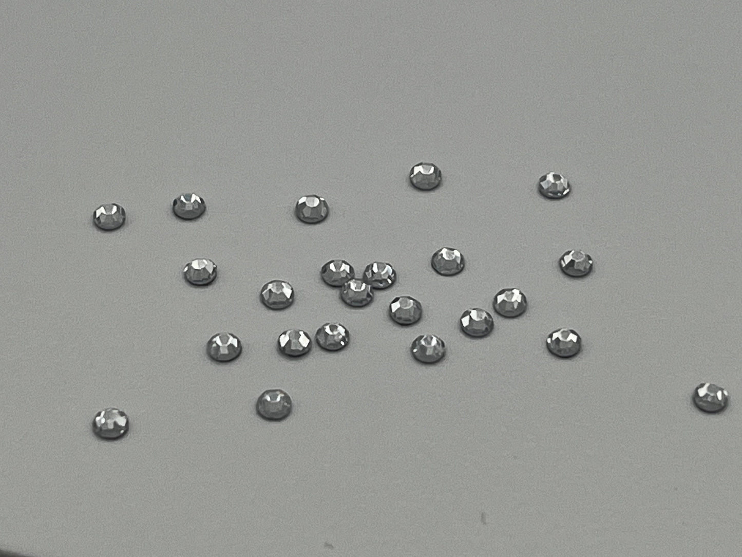 Iron On Hotfix Hot Fix Crystal Rhinestones clear with flat back. 1 pack is 1440 pieces. Price for 1 pack. Size rhinestones SS4 and SS6.