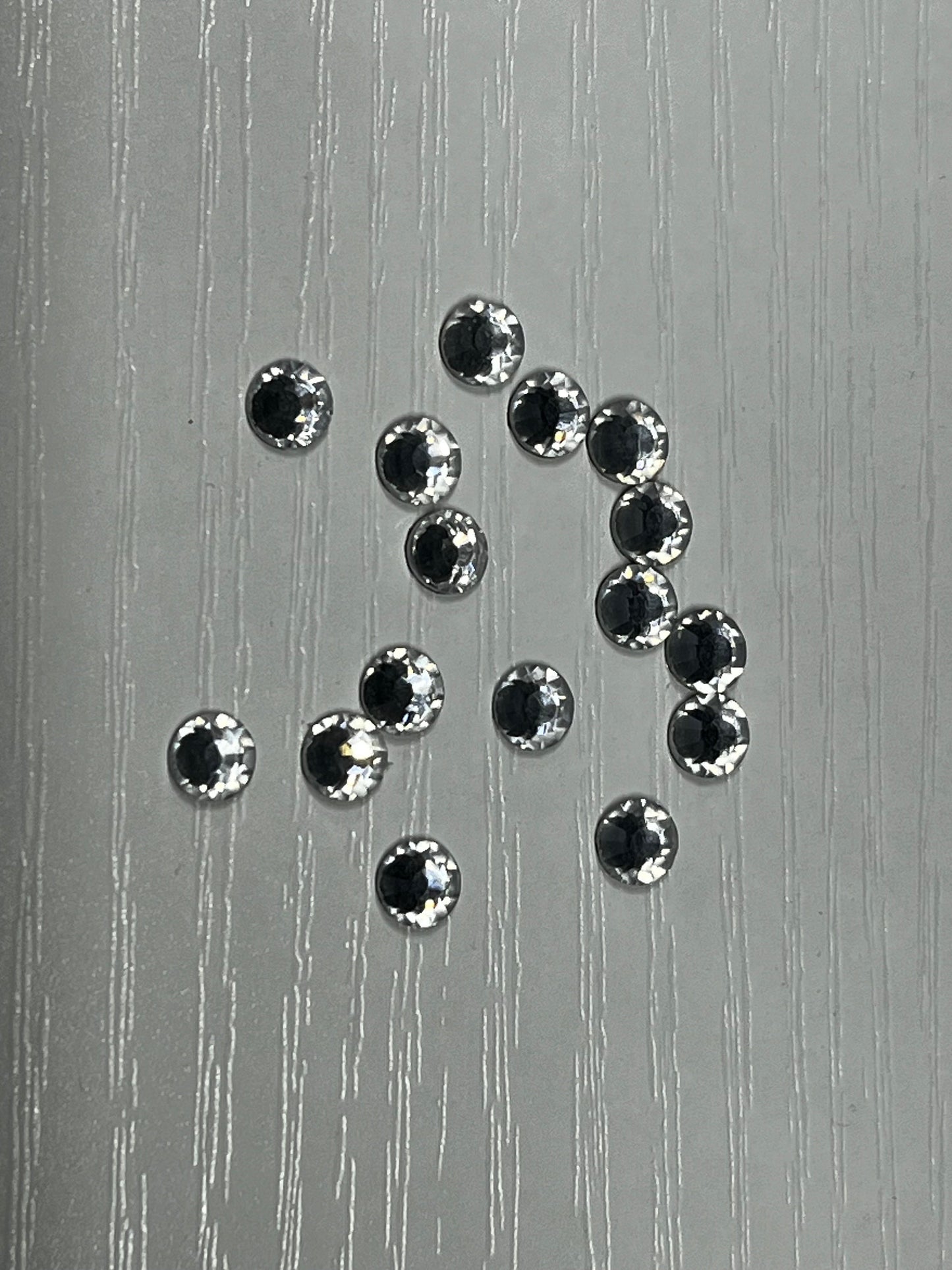 Iron On Hotfix Hot Fix Crystal Rhinestones clear with flat back. 1 pack is 1440 pieces. Price for 1 pack. Size rhinestones SS4 and SS6.