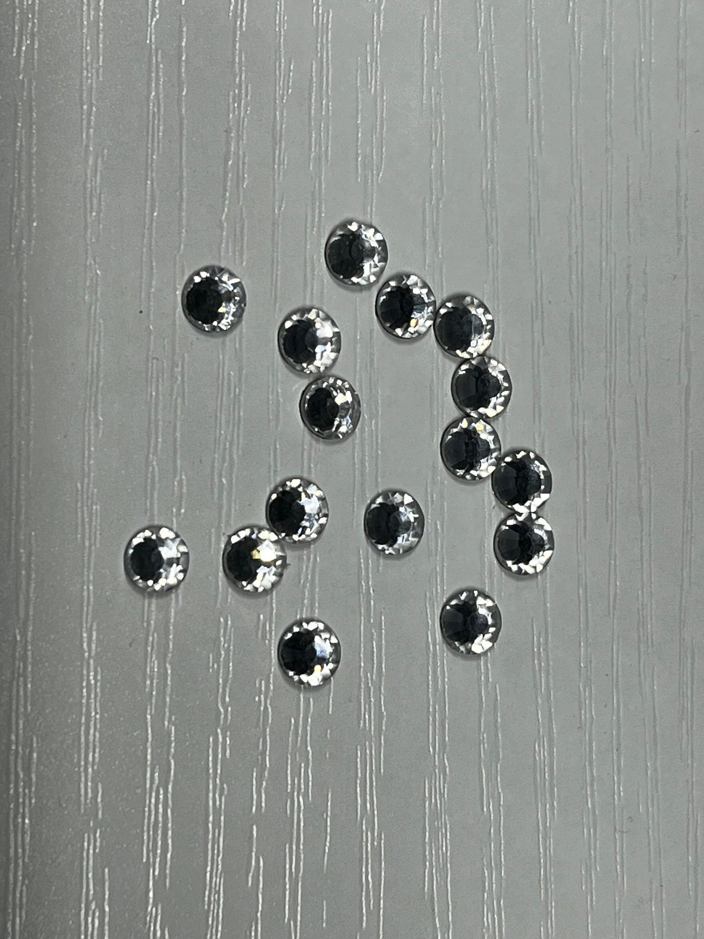 Iron On Hotfix Hot Fix Crystal Rhinestones clear with flat back. 1 pack is 1440 pieces. Price for 1 pack. Size rhinestones SS4 and SS6.